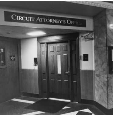 Black and white photo of entry to St. Louis City Circuit Attorney's Office in Mel Carnahan Courthouse.